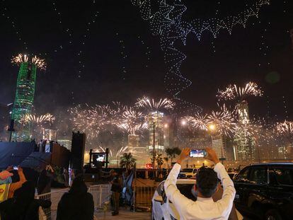 People watch fireworks and a light show, as Saudi Arabia celebrates winning its bid to host the World Expo 2030, in Riyadh, Saudi Arabia, November 28, 2023.