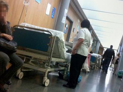 Patients lie in the corridor of an emergency ward at a Madrid hospital.