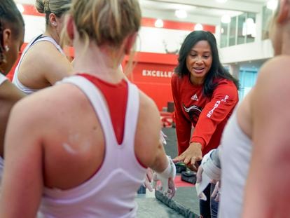Rutgers women’s gymnastics coach Umme Salim-Beasley joins a huddle during a practice at Rutgers in Piscataway, New Jersey, on March 2, 2023.