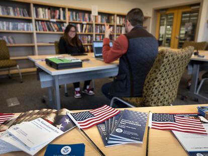 A Citizenship and Immigration Services officer instructs an immigrant ahead of her naturalization exam, on August 9, 2023, in Alaska.