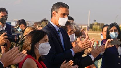 Spain's PM Pedro Sanchez (c) and Defense Minister Margarita Robles (to his right) receiving Afghan evacuees at the Torrejón military base in Madrid on August 27, 2021. 