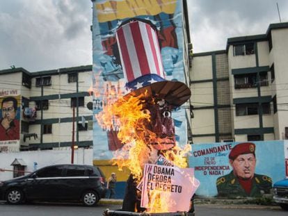 A giant effigy of President Obama burns on a street in Caracas.