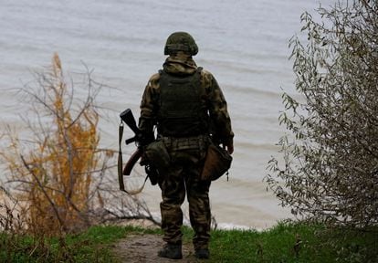 A Russian soldier, facing the Dnipro River, in late November. 