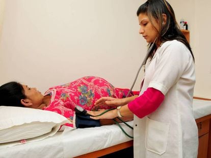 A surrogate mother undergoing a medical exam in India.