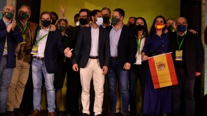 Vox leader Santiago Abascal (front row, third from right) with regional candidate Ignacio Garriga after learning that the far-right group has entered the regional parliament with 11 seats.