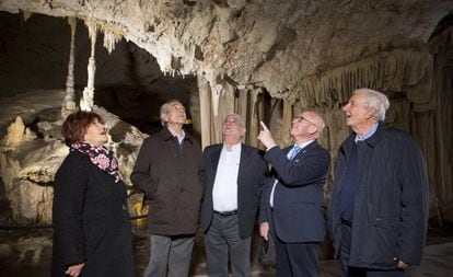 The four men who discovered the cave and the widow of a fifth who died in 2007.