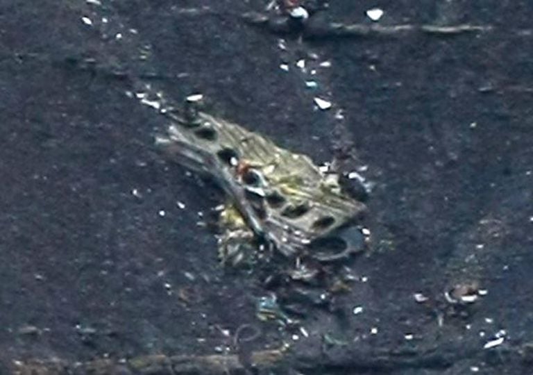 Debris of the crashed Germanwings passenger jet is scattered on the mountainside.