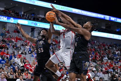 Memphis Tigers guard Damaria Franklin (55) and forward Chandler Lawson (4) and Houston Cougars guard Jamal Shead (1) battle for control of the ball during the first half at Dickies Arena on March 12, 2023.