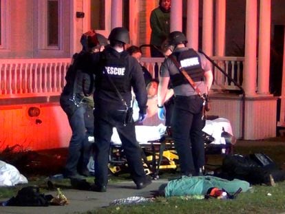 First responders treat a victim after a gunman shot and wounded three college students of Palestinian descent in Burlington, Vermont, U.S. November 25, 2023 in a still image from video.