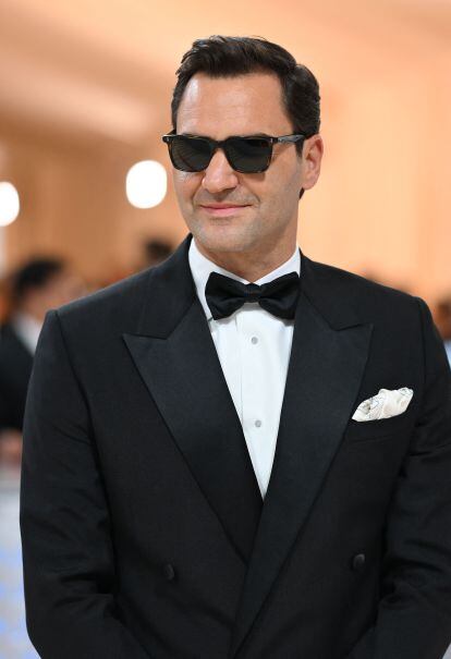 Tennis player Roger Federer, a close friend of Anna Wintour's and another host of the gala, in sunglasses and a Dior tuxedo.