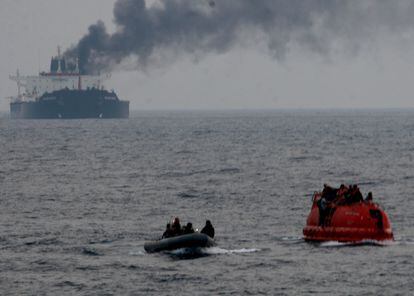 The crew of Brilliante Virturoso abandoned ship due to a fire aboard the vessel, in the picture they await rescue from US Navy sailors aboard their red lifeboat, on July 6th, 2011.