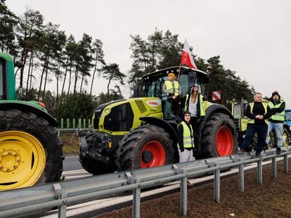 Polish farmers with their tractors take part in a protest between the towns of Zakrzewo and Dabrowa, on the Poznan-Lawica transport junction, in Poland, February 20, 2024.