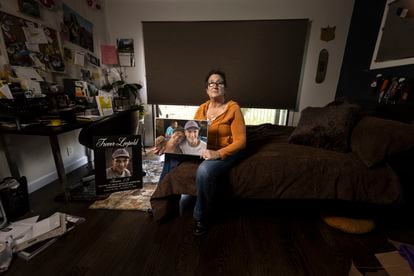 Michelle Leopold holds a photo of her son Trevor in the room where he used to sleep in their Marin County, Northern California, home.