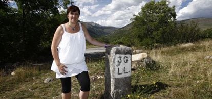 The mayor of Llivia, Silivia Orriols, by one of the stones that marks the limits of the village.