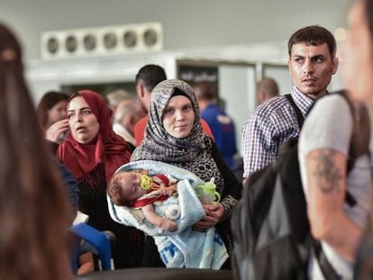 The Al Said family waits inside Beirut airport for their flight to Spain.