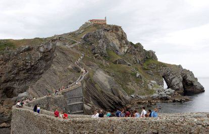 Tourists at the San Juan de Gaztelugatxe hermitage in Bermeo.