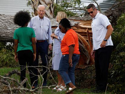 U.S. President Joe Biden and first lady Jill Biden talk with people as they tour Hurricane Idalia storm destruction in a neighborhood of Live Oak, Florida, U.S., September 2, 2023.