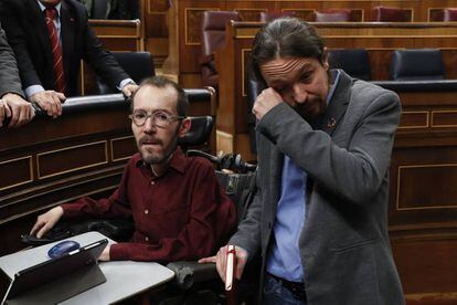 Unidas Podemos leader Pablo Iglesias (r) dries tears following Pedro Sánchez's victory on Tuesday. The Socialist Party and Unidas Podemos will now head a coalition government, something that has not been seen in Spain since the days of the Second Republic in the 1930s.