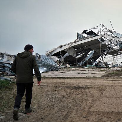 Sergei Yatsenko, manager of the Agrosvit farm in Shestakove, on November 11, in front of one of the stables destroyed by Russian shelling.