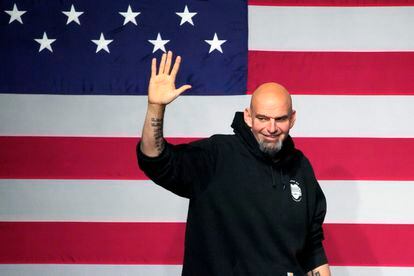 John Fetterman takes the stage at an election night party in Pittsburgh on Nov. 9, 2022.