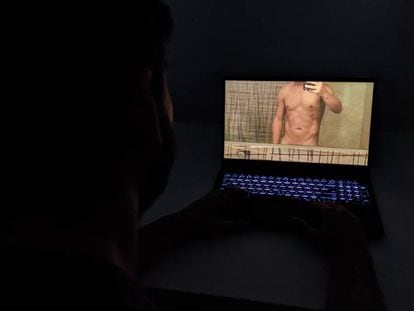 A user views a photograph of a naked man.