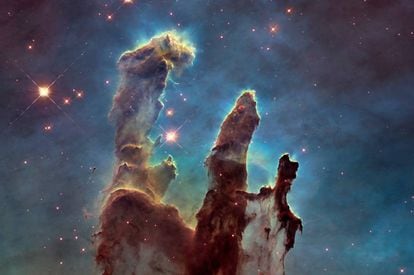 The Pillars of Creation, in the Eagle Nebula 7,000 light years from earth, photographed by the Hubble Space Telescope.