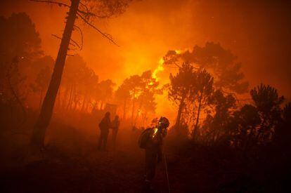 A fireman walks between burned trees in a forest fire in the municipality of Tabuyo del Monte in Spain’s Castilla y León region, on August 21, 2012. Around 500 soldiers were sent to the area to fight the fire, which authorities said consumed 80 square kilometers of forest. Climate change is the leading cause: with less rain, the soil is parched. Forest fires have become increasingly more intense and more difficult to put out. Drought and extreme temperatures change the forest mass, making it burn faster.