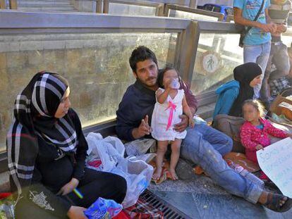Kheder Ramadan with his family and other refugees outside the government offices in Ceuta.