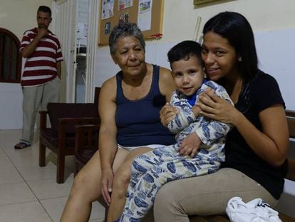 Venezuelan Susana Guevara, with one of her children, in Colombia.