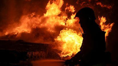A firefighter works at the scene of a Russian drone attack in Kharkiv on February 1.