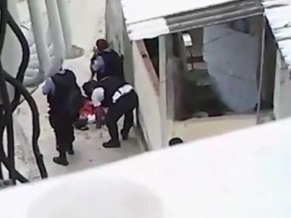 A still from the video of police purportedly altering the murder scene in Rio.