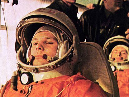 Yuri Gagarin, prepared to depart on the rocket that would take him on the first-ever space flight. Behind him is Gherman Titov, ready to replace him in case of any eventuality.