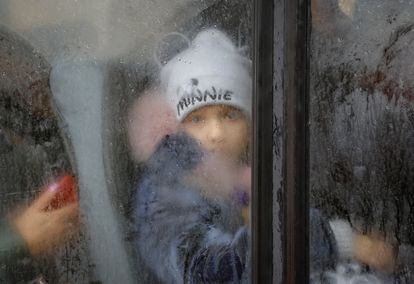 A child evacuated on Monday from the city of Kherson, on a bus leaving for Crimea.