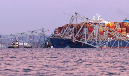 Emergency personnel work alongside the container ship following the collapse of the Francis Scott Key Bridge Tuesday in Baltimore. 