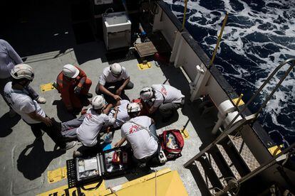 Personnel from Doctors Without Borders explain basic CPR to the crew ahead of their first rescue mission, on June 9.