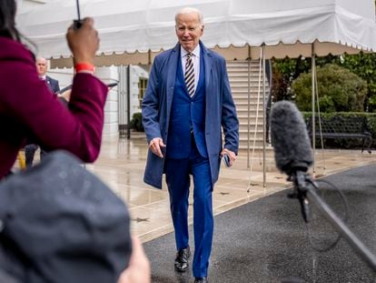President Joe Biden walks to reporters on the South Lawn of the White House before boarding Marine One in Washington, Tuesday, Jan. 31, 2023.