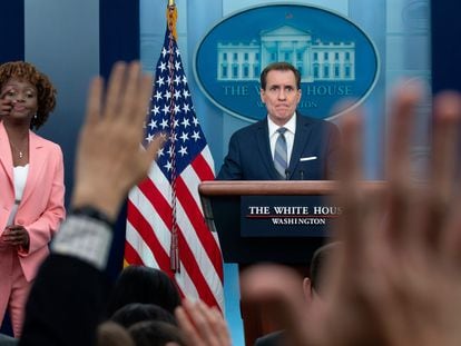 National Security Advisor for Strategic Communications John Kirby (R) and White House Press Secretary Karine Jean-Pierre (L) in a news conference on April 10.