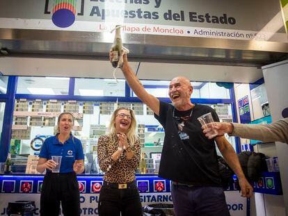 People celebrating outside a lottery sales point in Madrid's Moncloa district.