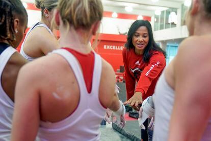Rutgers women’s gymnastics coach Umme Salim-Beasley joins a huddle during a practice at Rutgers in Piscataway, New Jersey, on March 2, 2023.