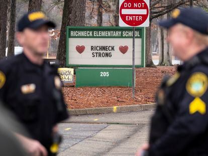 Police look on as students return to Richneck Elementary in Newport News, Virginia, on Jan. 30, 2023.