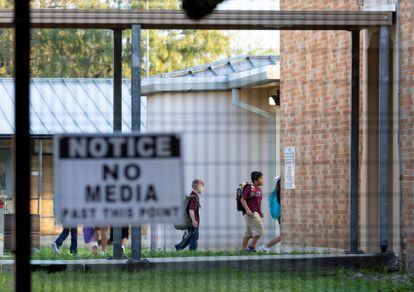 A sign on a security fence surrounding Uvalde Elementary warns the media against approaching the school.