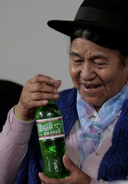 Antonia Rodríguez, the Bolivian minister for development and a plural economy, holds up a bottle of Coca Brynco, made with coca leaves.
