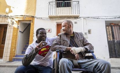 Gorgui Lamine and the man he saved, Alex Caudeli, in front of the latter's house.