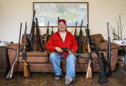 Scott Porter, with his many guns at home in Louisiana.