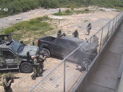 Soldiers approach the van that has just crashed in Nuevo Laredo.