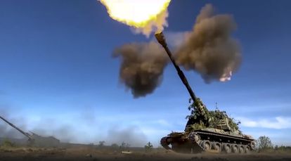 This photo taken from video released by Russian Defense Ministry Press Service on June 5, 2023, shows a Russian self-propelled gun firing towards Ukrainian positions at an undisclosed location.