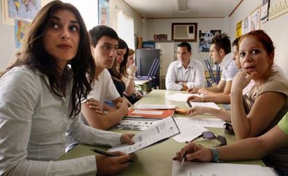 Young people attend a class at an adult learning center in Alicante.
