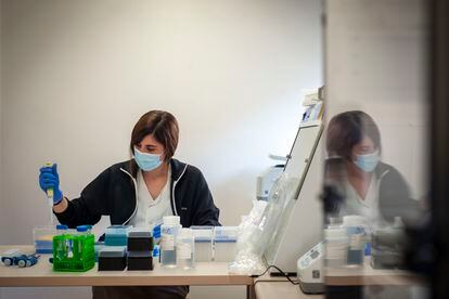 A microbiologist works with coronavirus samples at a sequencing laboratory in Vall d'Hebron Hospital, Barcelona.