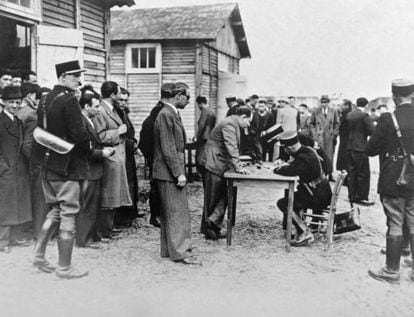 French policemen register foreign Jews in Pithiviers for their subsequent deportation, in May 1941.