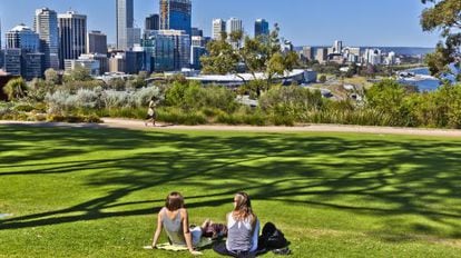 Two young people relax in Kings Park in Perth, Australia.